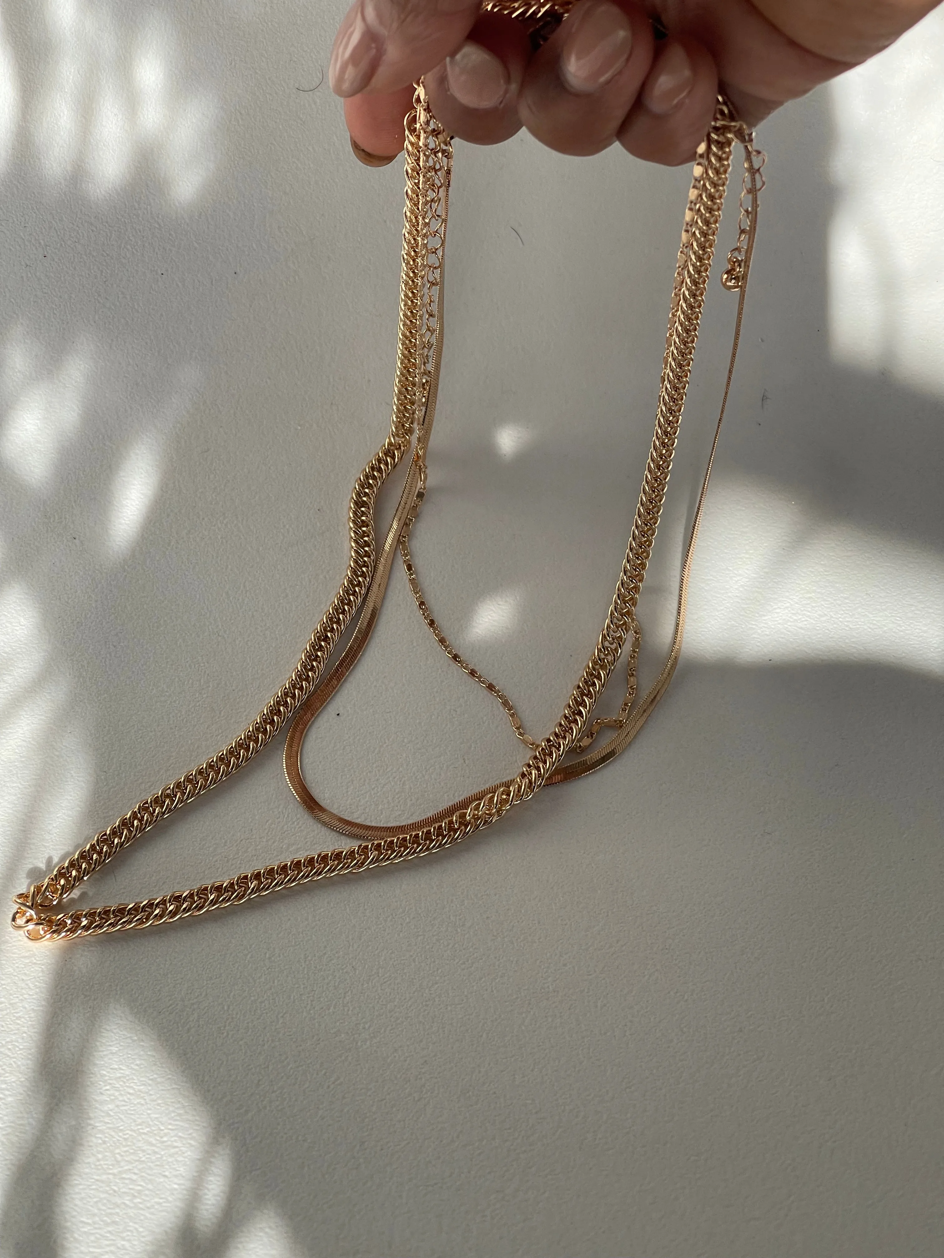 Liz Stainless Steel Tri Layered Necklace Set In Gold