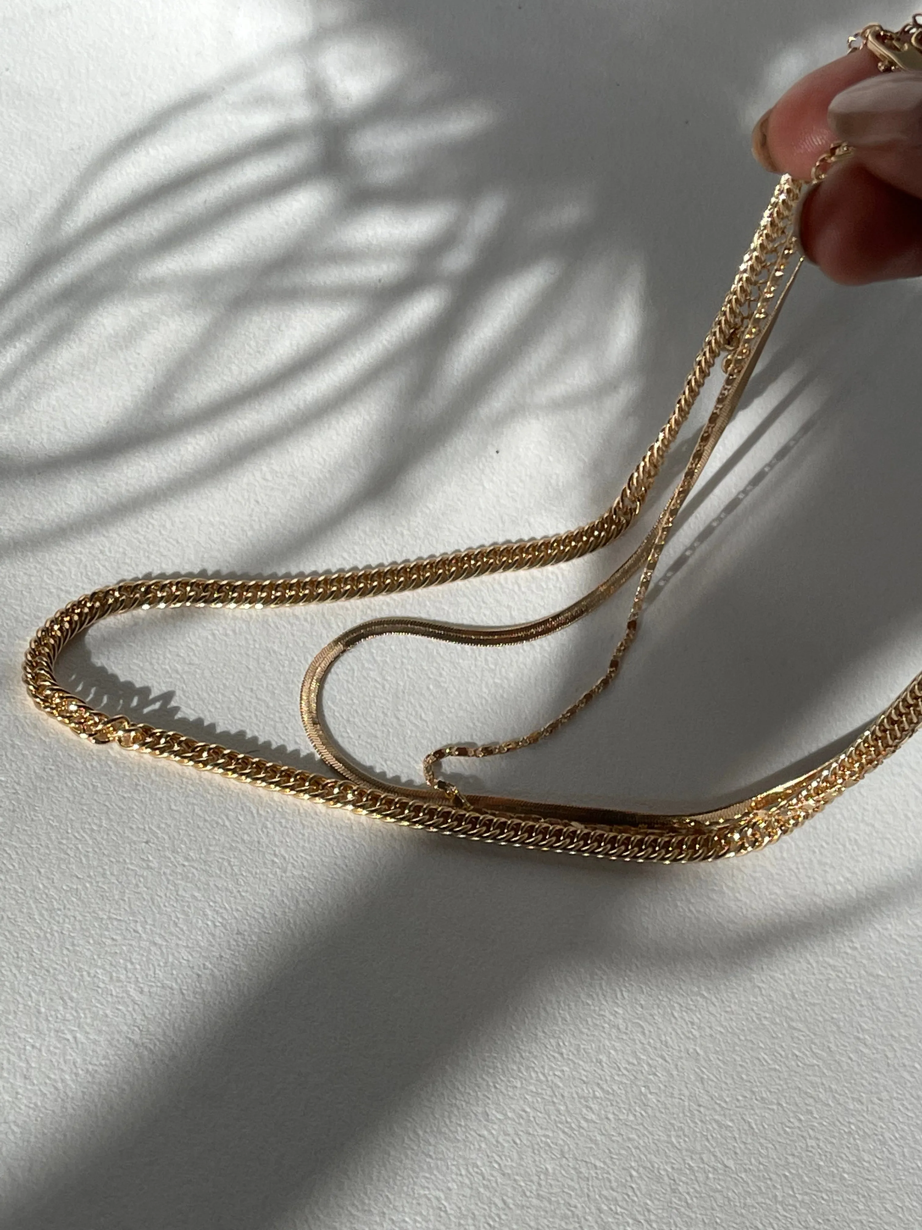 Liz Stainless Steel Tri Layered Necklace Set In Gold